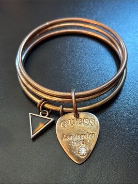 GUESS Gold Tone Stackable Bangle Set with Guitar-Pick and Triangle Charms